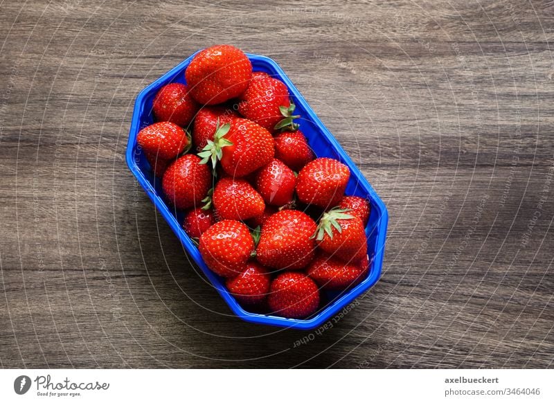 topview of strawberries on wooden background strawberry fruit food garden strawberry vitamin C basket container red ripe german Fragaria ananassa vegetarian