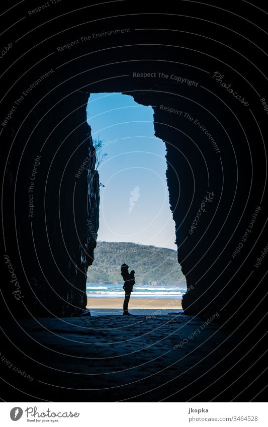 Woman in cave at the beach New Zealand Identity Vacation & Travel Moody Tourism Colour photo Exterior shot Light Shadow Silhouette Blur Nature Adventure