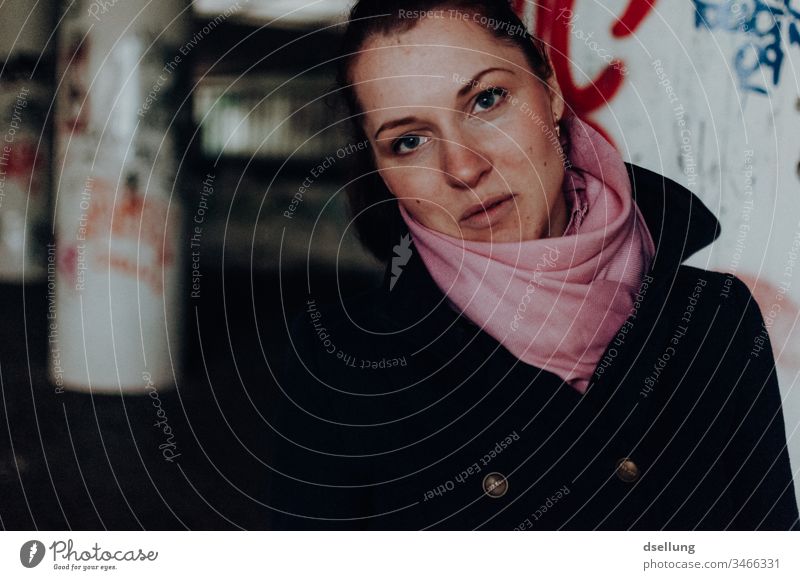 Young woman in urban environment smiles into the camera Looking into the camera Tourism Weather Interest Curiosity Life Inspiration Upper body