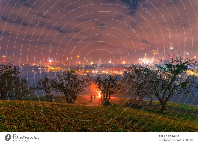 New Year's Eve Party with fireworks and the view at munich, bavaria. festival new year Explosion background abstract tree house Winter event night celebration