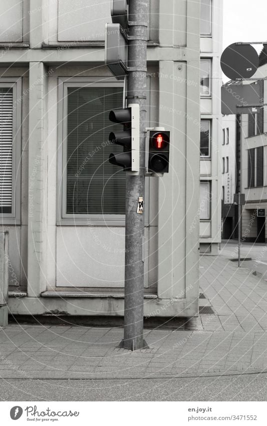 red traffic light at the roadside in the city Traffic light Red ampelmännchen Road sign Pedestrian traffic light stand still standstill Town downtown