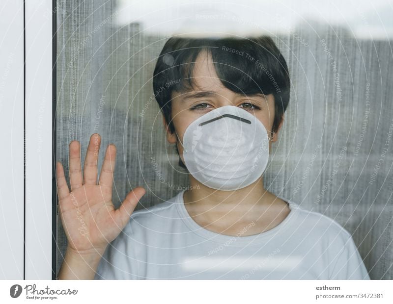 Quarantined child by the Coronavirus pandemic with mask medical coronavirus epidemic quarantine sad covid-19 symptom medicine health childhood sadness positive