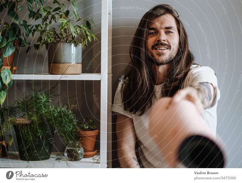 Yoga man with plants yoga posa Portrait photograph Interior shot Colour photo Adults Man Masculine yoga mat Sports Training Fitness Lifestyle Relaxation