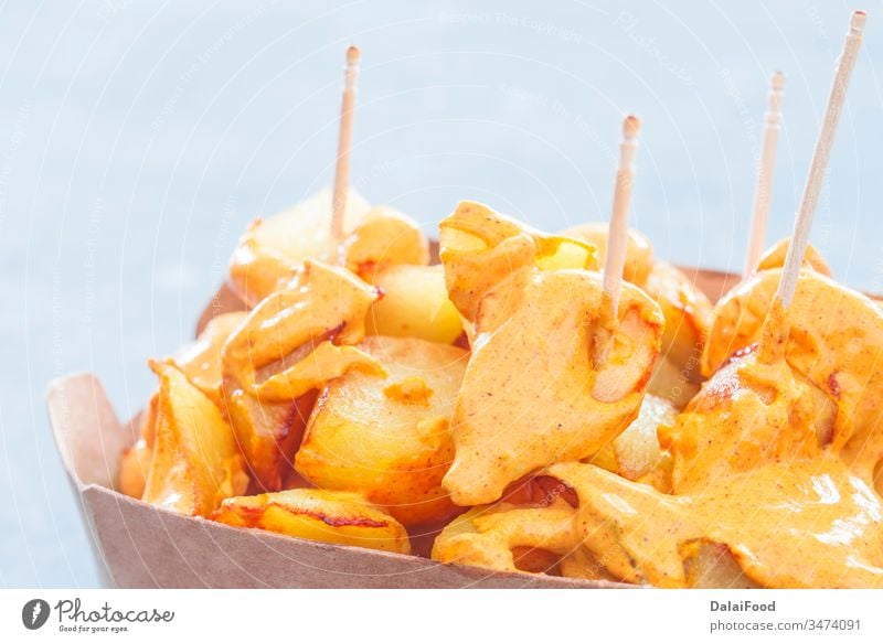 Patatas bravas traditional Spanish take away background baked bar chips closeup cuisine dish food fried garlic home horizontal ketchup mayonnaise mediterranean