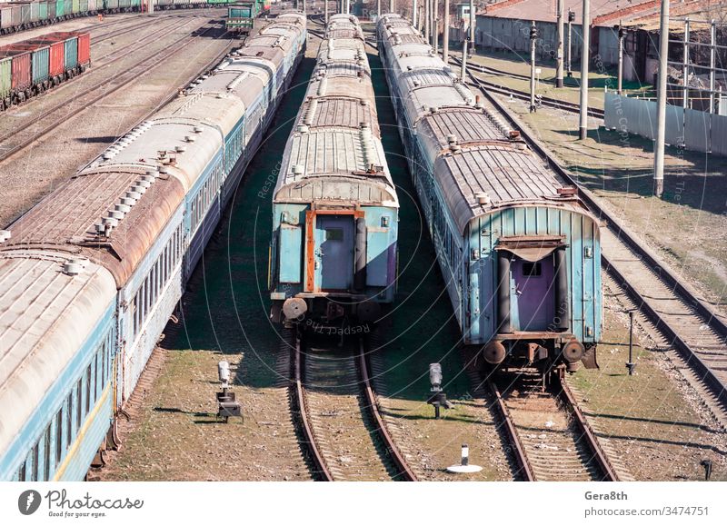 old rusty abandoned trains at a station in Ukraine collapse color colored corruption crisis despondency dirty economy enterprise europe grass green grunge harm