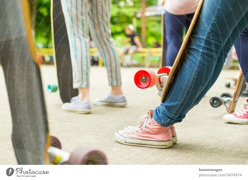 Teenage girl practicing riding long board. urban skateboard sport one lifestyle skateboarding fun skater youth young summer street fashion woman cool casual