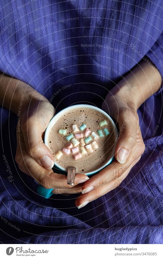 A woman in a purple dress holds with both hands a turquoise cup with cappuccino decorated with mini-marshmallows Cup Cappuccino hold cup Coffee Beverage