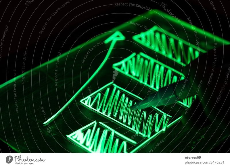 Graphic drawn with fluorescent marker business close-up concept economy finance forex graphic green hand image investment light outlay payment plan putting