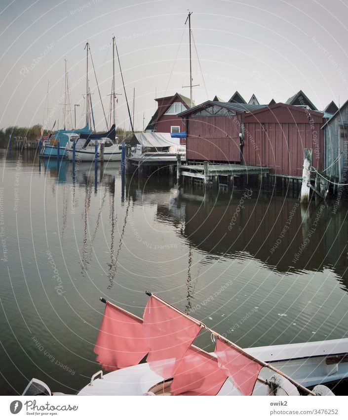 Ahrenshoop, Althagen Harbour Exterior shot Sky Boathouses Simple silent Idyll Peaceful boat flags Signal Buoy boats sailboats Reflection Water Surface of water