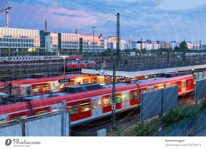 Railway with trains on Hackerbrucke train and S-bahn station in Munich, Germany munich train station railway transportation railroad day europe sky transit