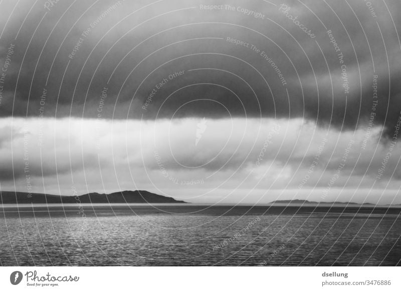 Black and white image of a lake in the Scottish Highlands under cloudy skies Panorama (View) Shadow Light Day Contrast Hollow Scotland Gray Wild natural chill