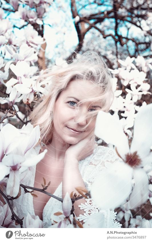 Beautiful blonde woman with white dress in a flower tree Portrait photograph Woman Blonde Tree out Nature Landscape Face Beauty & Beauty beautifully