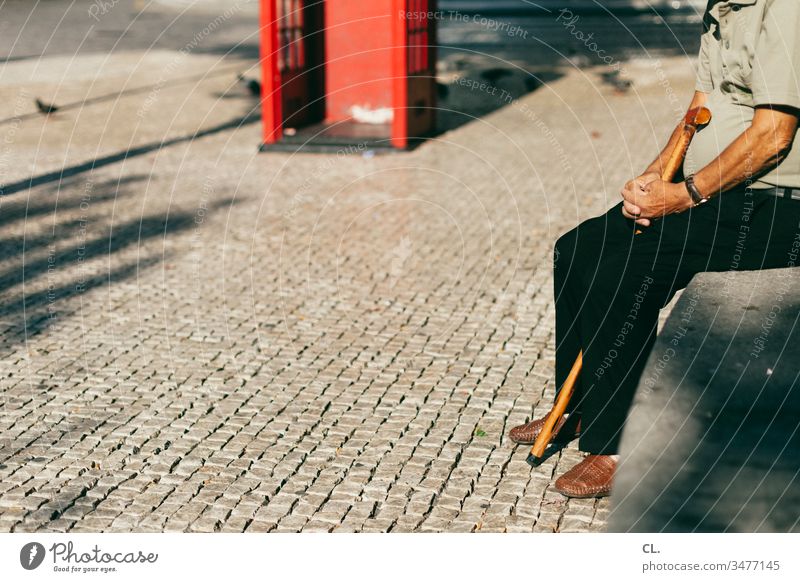 older man sitting on wall Man Senior citizen Stick age Wait Sit Male senior Exterior shot Colour photo 60 years and older Human being Day Authentic