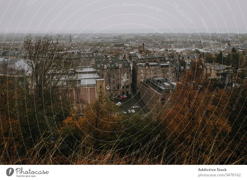 Ancient city in foggy autumn day ancient historic old architecture building cityscape gloomy scotland town tree mist travel tourism urban district sky cloudy