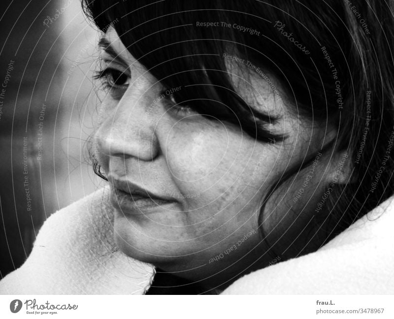 Black hair and and a white woollen blanket framed the soft and vulnerable face of the young woman. Woman Young woman Portrait photograph Feminine Face