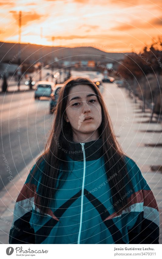 Vintage girl in the middle of a street with a sunset in the background Girl Vintage girls Portrait photograph Sunset Street Orange sweet girl Cute Beautiful