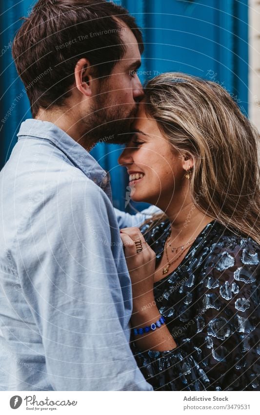 Lovely couple kissing near old building love together relationship embrace happy city historic stone travel romantic boyfriend girlfriend hug date affection