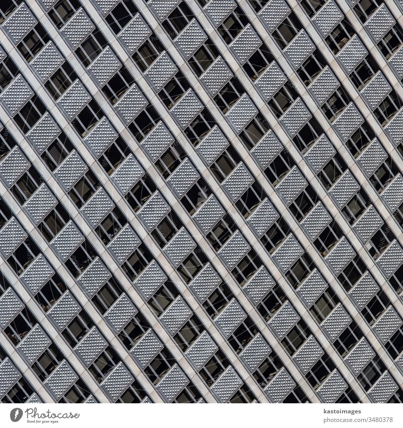 Windows of a modern office building. architecture facade windows pattern steel background construction glass design estate exterior futuristic high light urban