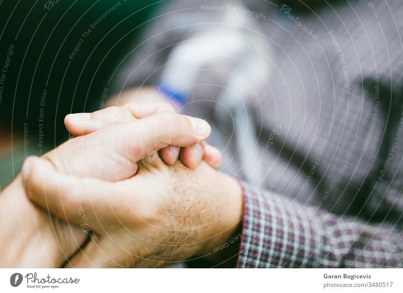 Holding hands for support with senior man  using medical equipment for inhalation with respiratory mask, nebulizer aerosol air allergy asthma asthmatic breath