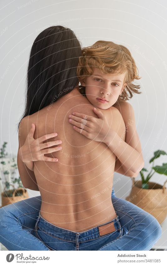 Tender mother embracing sad son kid hug comfort woman boy bare tender together love embrace parent care child affection female relationship childhood cuddle