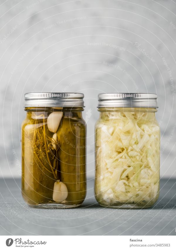 Glass jar with pickled cucumbers, copy space dill sauerkraut marinated canning green glass vegetable above salted wild whole vinegar lebanese eating spicy