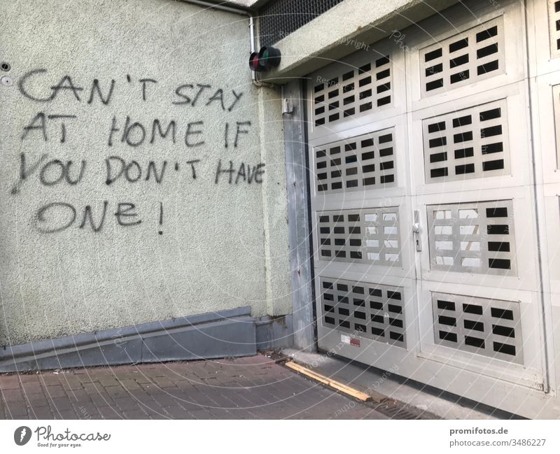 Graffiti: "Can't stay at home if you don't have one" / Photo: Alexander Hauk protest Demonstration Wall (building) house wall Garage garage entrance policy