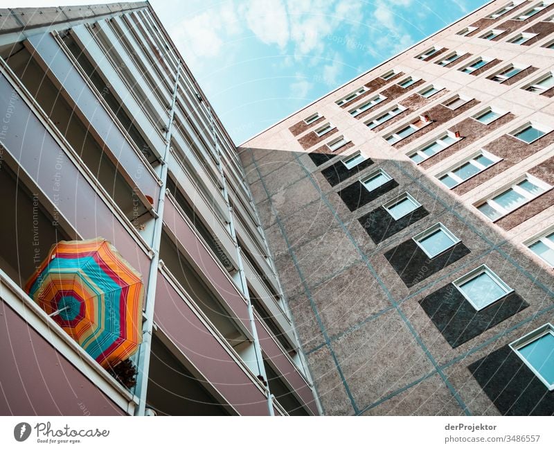 High-rise building with balconies and twisted parasol metropolis Freedom City Berlin center Panorama (View) Sunbeam urban Beautiful weather City life Sunlight