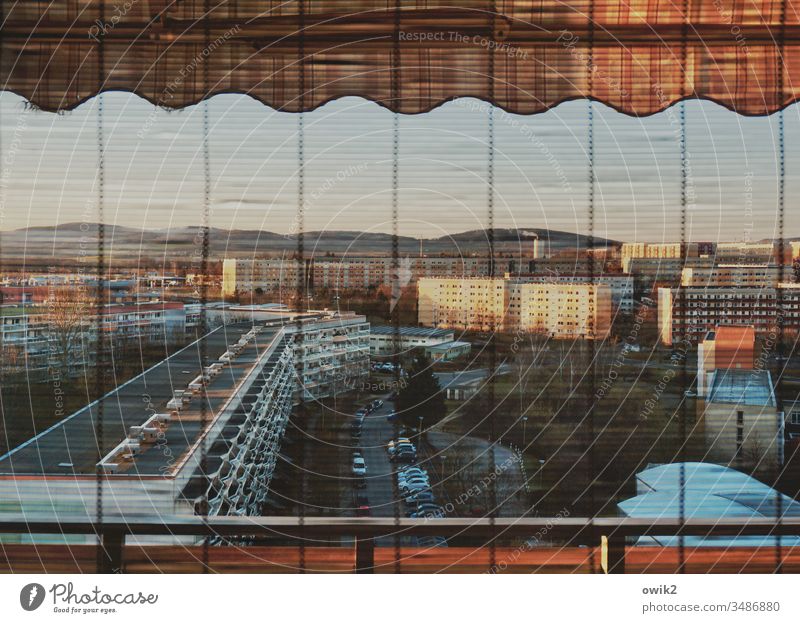 Sleeping city Window view outside Panorama (View) Overview balustrade rail Venetian blinds slats Prefab construction blocks of flats Balconies Colour photo