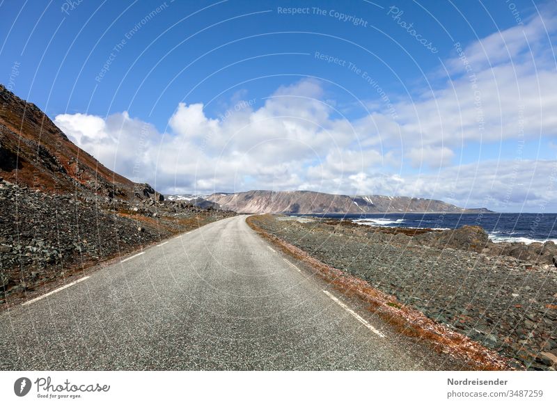 Boundless breadth Street Ocean Coast Coastal road gravel Asphalt travel Water ocean Varanger Finnmark Norway mountains Bizarre Rock wide boundless Freedom