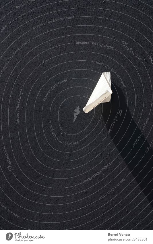 Little something Paper Snippets Shadow Light Black & white photo Wind Wall (building) House (Residential Structure) Stick Label Discovery Detail Wall (barrier)