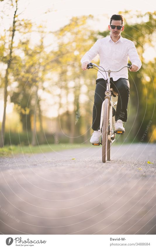 Young man on the road with his bike Bicycle Transport Street Cycle path Driving Means of transport Traffic infrastructure Lanes & trails Cycling Movement