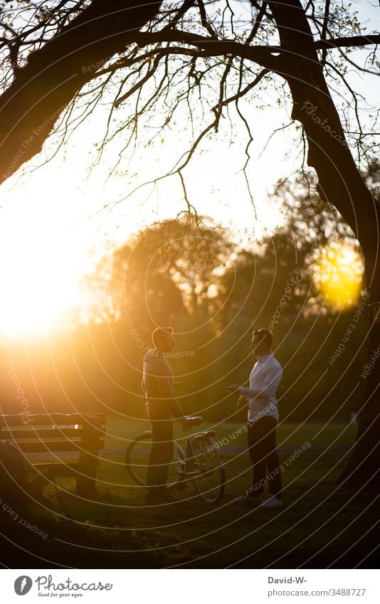 taking a break with the bike sunlight social contacts men talk Cycling Friends Bicycle Friendship maintain meetings Cycling tour Man Sunlight Beautiful weather