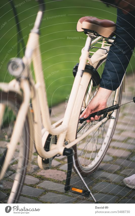 cycling man rides a bicycle through nature and makes a bicycle tour Cycling Air pump Bicycle slabs Tire Cycling tour Man Sunlight Anonymous Beautiful weather