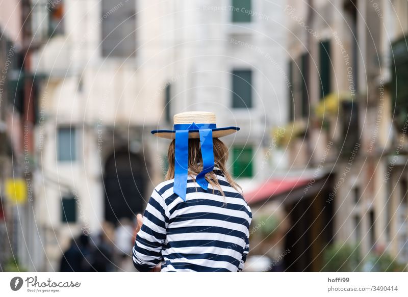 Gondolieri looks at the city gondolieri Venice Italy Gondola (Boat) Canal Grande Channel Old town Hat blue ribbon striped shirt Exterior shot Rialto Bridge