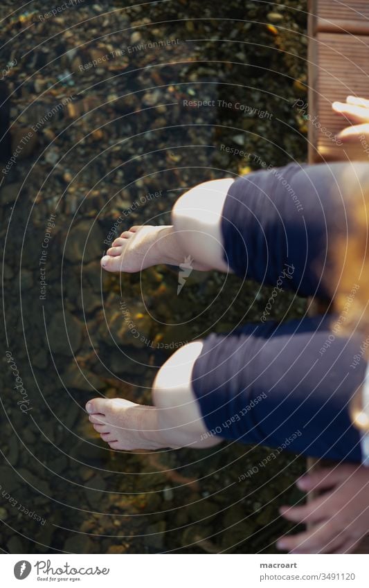 Feet in water Child feet Girl Schoolchild Boredom cold Water naked Legs Dangle chill sneaking away Summer Day Footbridge Lake Body of water Swimming lake