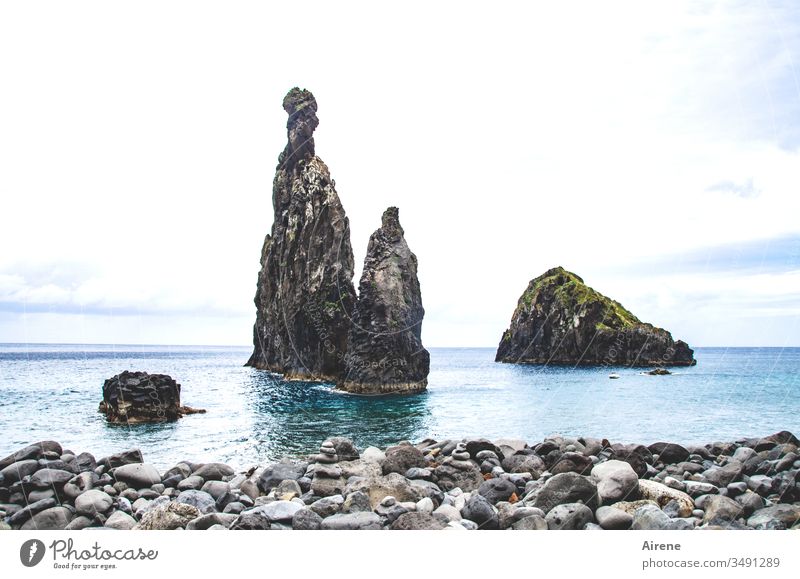 as time gnaws at one's teeth Rock Ocean Steep Island Madeira rock needles cliffs Stony Coast Sky Blue Water Deserted Pebble beach turquoise Impressive Prongs