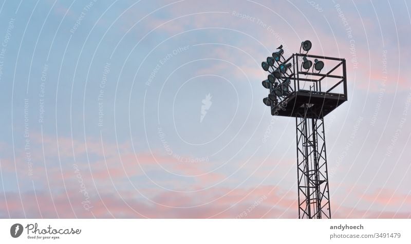 The floodlight in the morning with a pink sky architecture bird blue built structure cloud cloud sky copy space dramatic sky electric lamp equipment