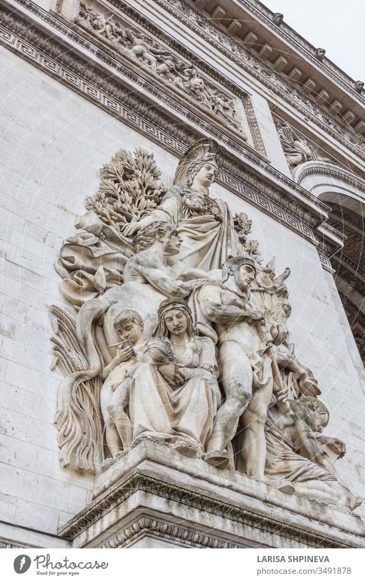 Arc de Triomp with elements of sculptures designed by Jean Chalgrin in 1806 on the Place de Gaulle in Paris, France Arch triumph Flag Monument Europe City