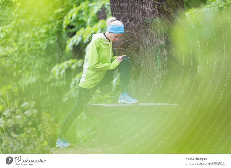 Sporty woman  working out in forest. sport workout exercise active girl stretching outdoor fit nature female activity young person lifestyle sporty recreation