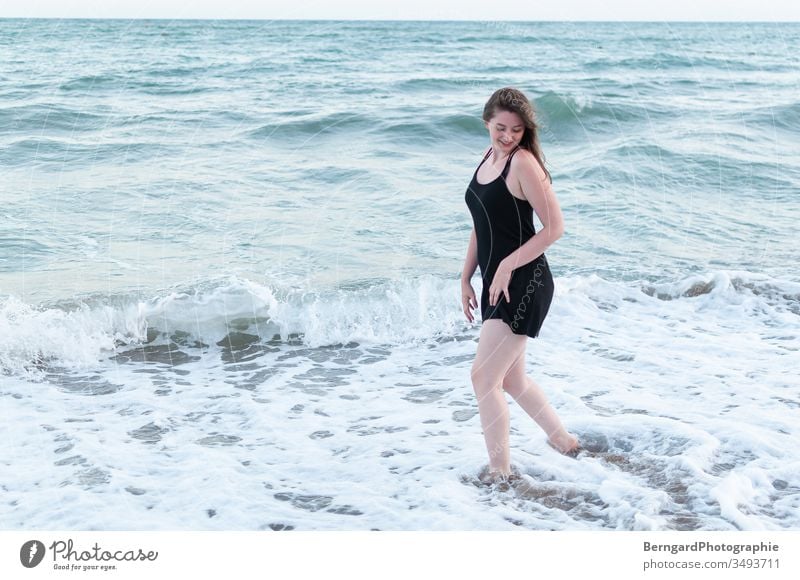 Girl at sea Ocean Water Waves Beach Sand Vacation & Travel Woman girl Beautiful happy smile