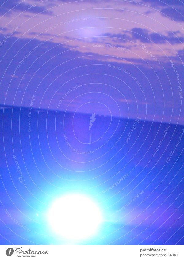 Light ball of spotlight in front of a violet sky. At an open air event in the Allgäu. Photographer: Alexander Hauk Clouds Blue Happiness Wisdom UFO Corona