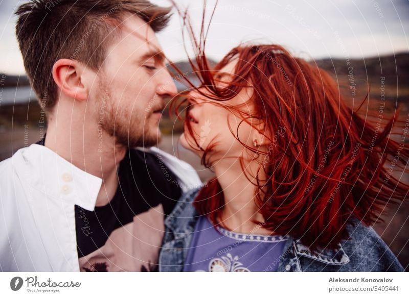 Young couple before kissing. Her hair flying in a wind laughing Youth (Young adults) Masculine Feminine Happiness Safety (feeling of) warmth Relationship Couple