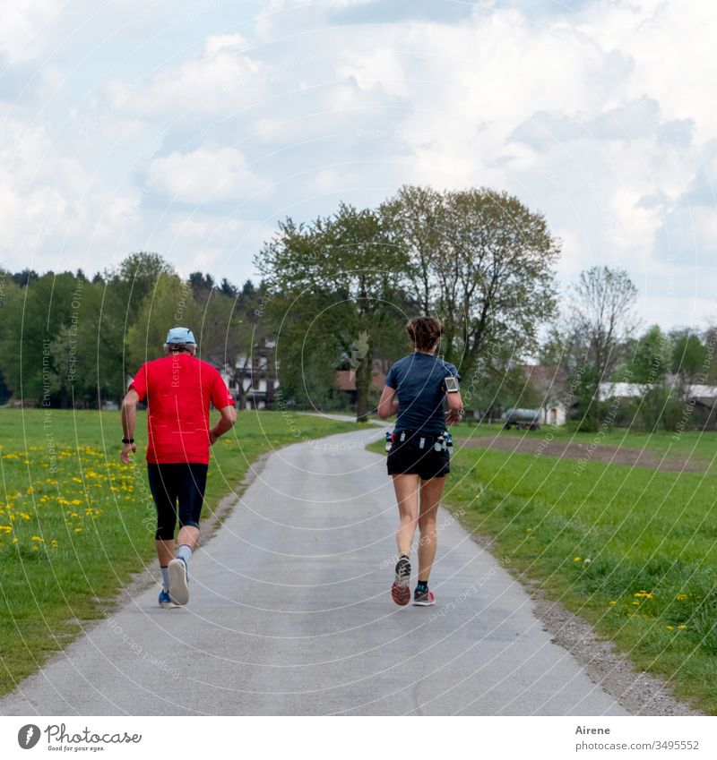 The winners of the marathon Walking Running sports Jogging Marathon hobby Sports Fitness fit Movement in twos Couple Legs Speed Target Street Rural