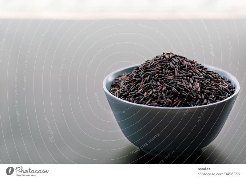 bowl of jasmine black rice on black backgrounds agricultural agriculture agriculturist asia asian berry breakfast cereal cloud cooked cooking cultivation dry