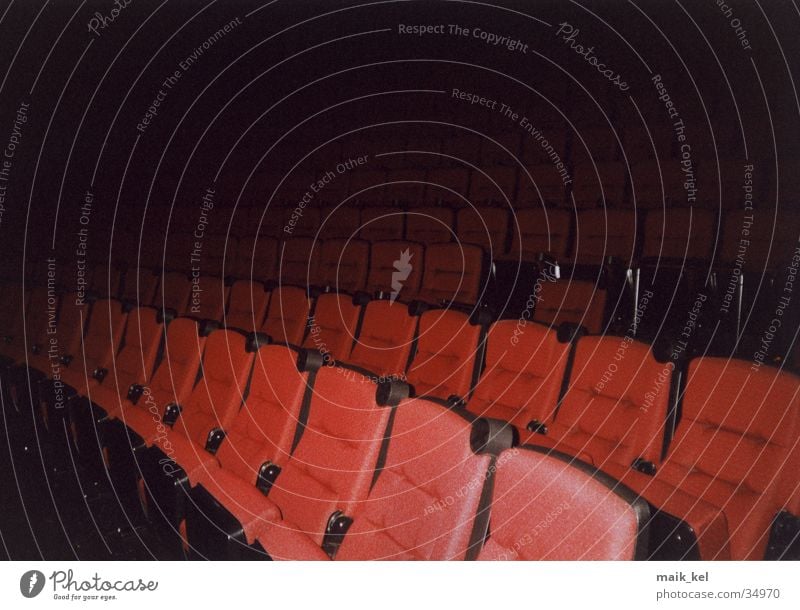 At the cinema Cinema Dark Row of seats Movie hall Lecture hall Leisure and hobbies Seating