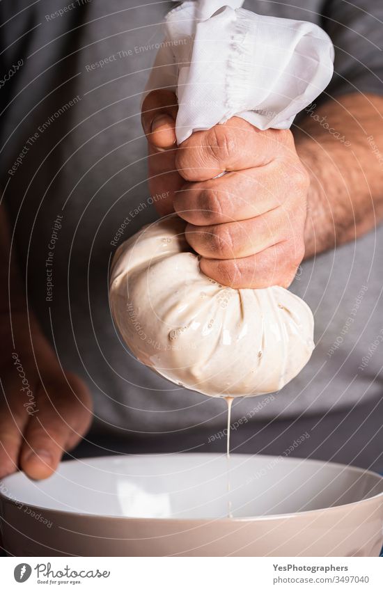 Horchata making of, man hands squeezing horchata paste. almonds milk beverage cinnamon cocktail cold drink dessert domestic life fresh freshness healthy drink