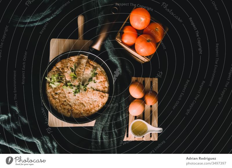 Closeup shot of an omelet in a roaster, fresh eggs, and tomatoes closeup breakfast breakfast menu food blog menu usage healthy breakfast Easter breakfast meal