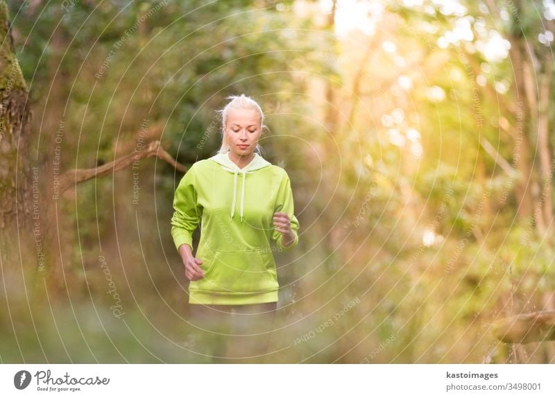 Pretty young girl runner in the forest. active sport female exercise fit woman person lifestyle recreation adult outside jogger leisure fitness athletic energy