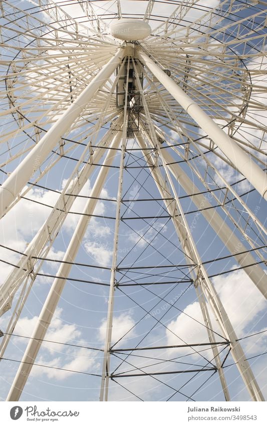 Ferris wheel in Munich Fairs & Carnivals Light Leisure and hobbies Sky Tall Feasts & Celebrations Round Exterior shot Colour photo Day Theme-park rides Blue