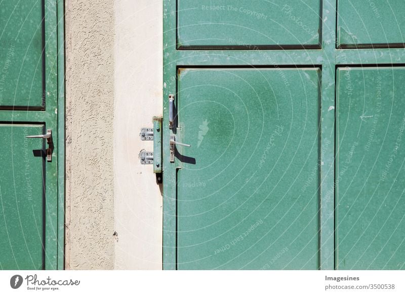 two green empty metal doors, sliding door, steel doors with masonry. Abstract Old Door Ancient Architecture backgrounds Empty Building outside business Cement